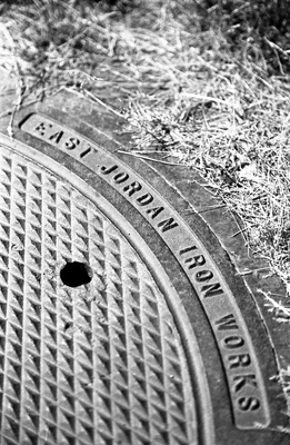 manhole cover with jordan iron works text